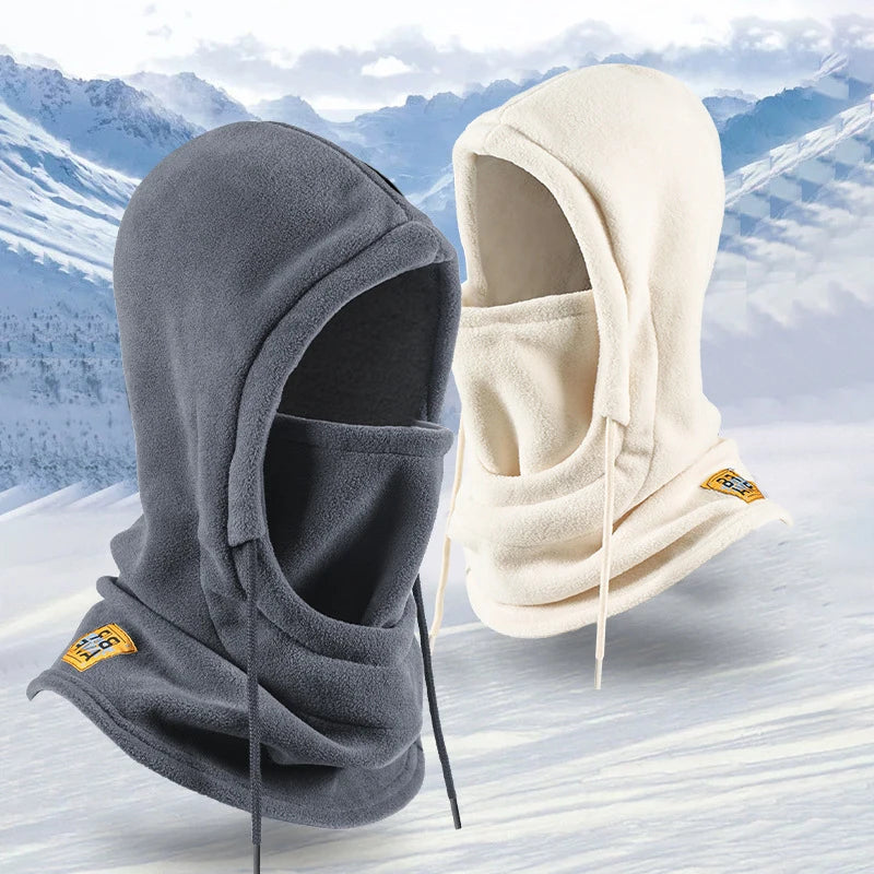 Halefield windproof fleece hood in gray and cream, mask up, on snow