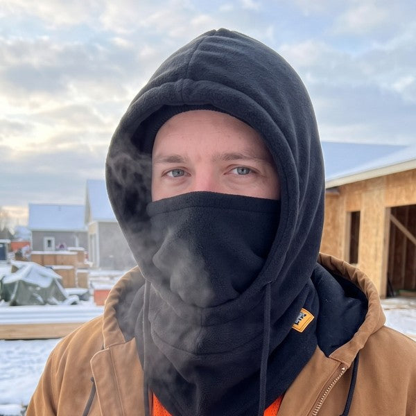 Worker wearing the black fleece hood with the mask up